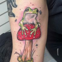 frog on toadstool tattoo by bella at tantrix body art