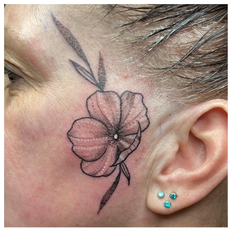 wild rose face tattoo by bella at tantrix body art