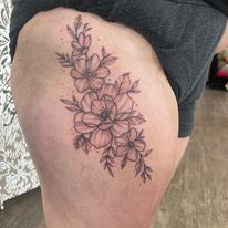floral leg piece tattoo by bella at tantrix body art