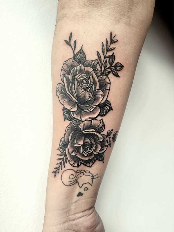 black and grey floral tattoo by nicole at tantrix body art