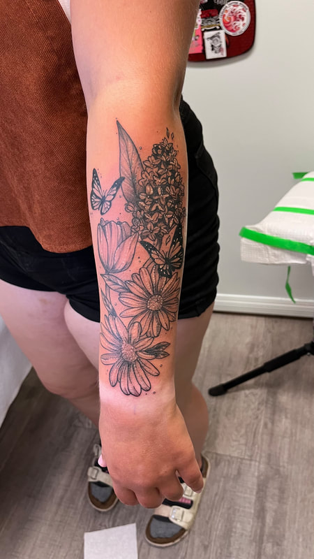 floral fine line tattoo by bella at tantrix body art
