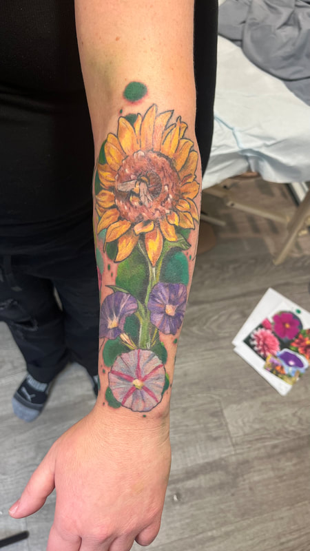colour floral tattoo by bella at tantrix body art